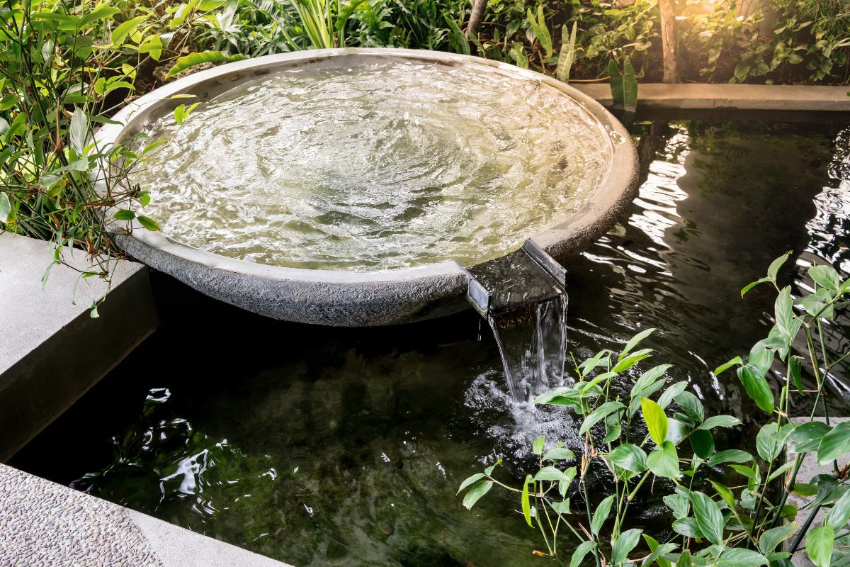 Circle shape water fountain and water fall in garden or park 1200x800px