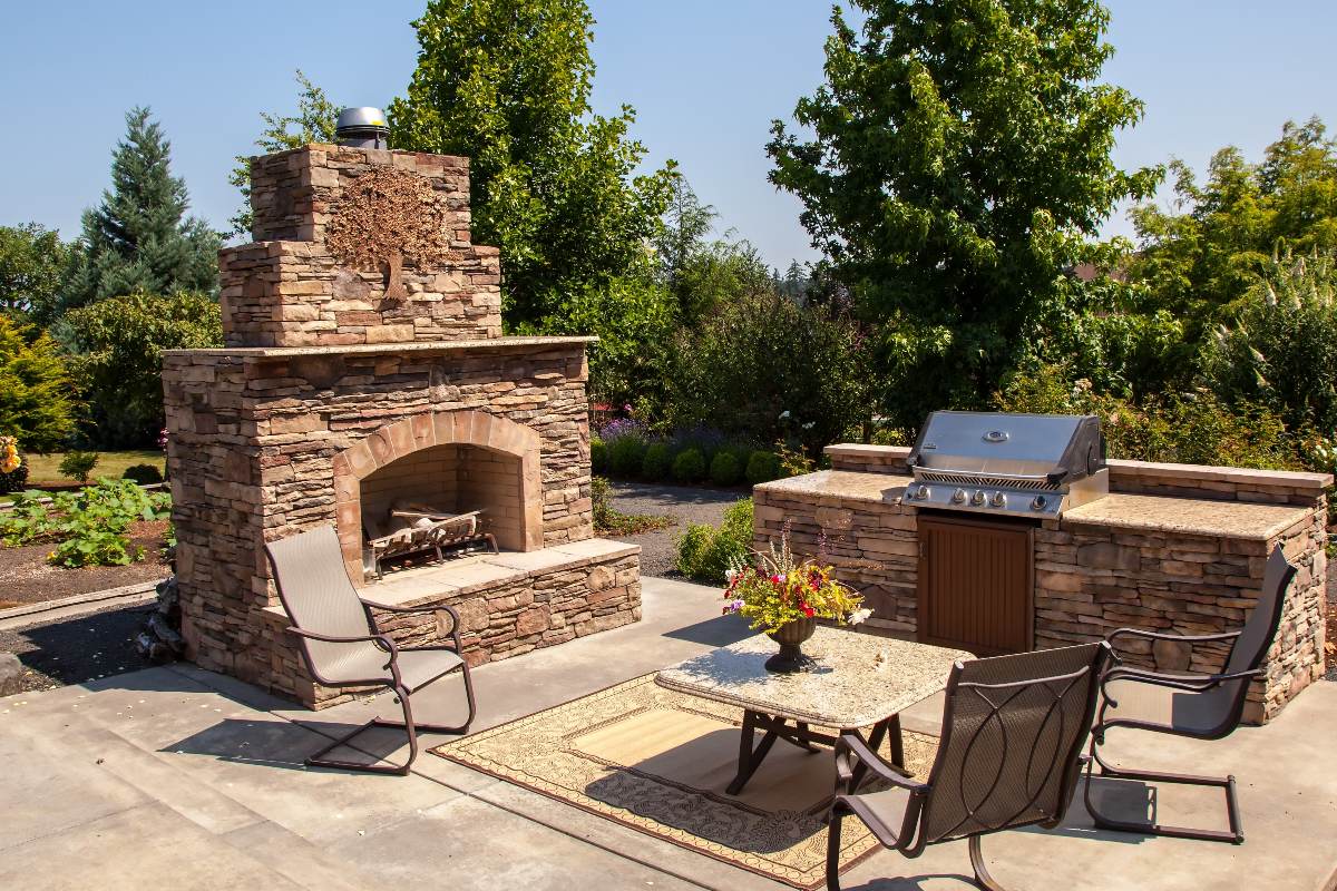 Outdoor fireplace and kitchen area Summer 1200x800px