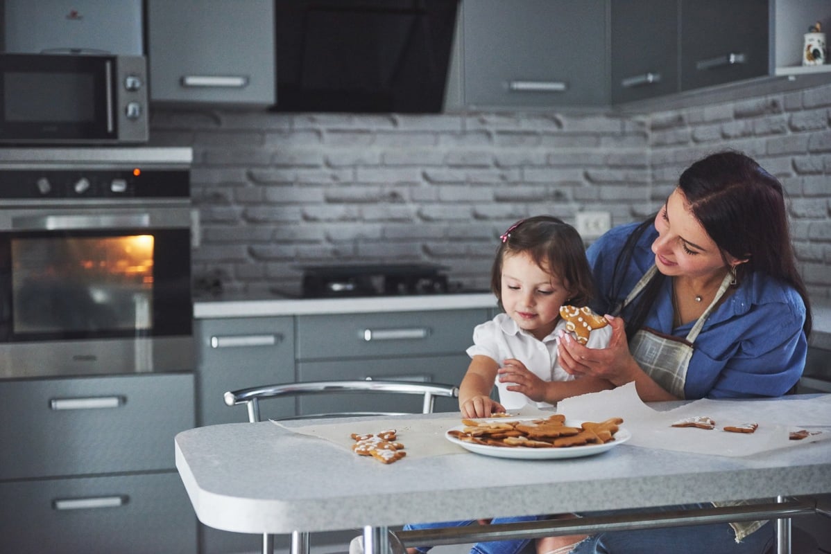 Mother and daughter enjoying new kitchen 1200x800px