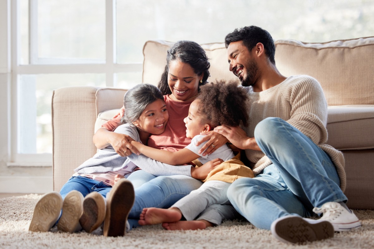 a loving family enjoying their perfect home 1200x800px