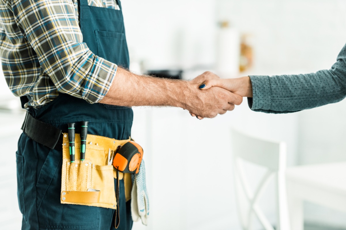 Shaking hands with the tradesman 1200x800px